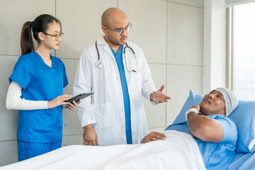 Fototapeta premium Doctor team visiting man cancer patient with care and compassion in hospital room. Oncology support medical consultation healthcare and hope. Doctor reporting medical test results to the patient
