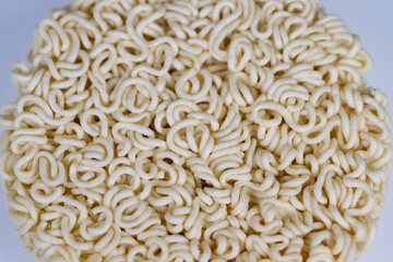 Round instant noodles cake centered on white studio background, topdown product composition, soft even lighting, ideal for packaging, ecommerce and minimal food branding