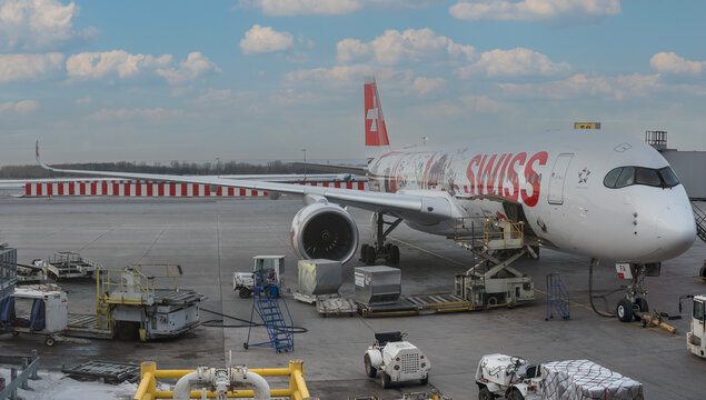 Swiss Airbus A350 special livery Wanderlust illustrates the diversity and beauty of the country Switzerland. Airplane at the gate of YUL Montr&eacute;al-Pierre Elliott Trudeau International Airport