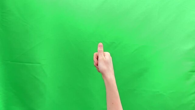 Thumb pad touching sensor for biometric authentication against green chroma background. Human hand performing identity verification gesture for secure digital access. Technology security concept for.