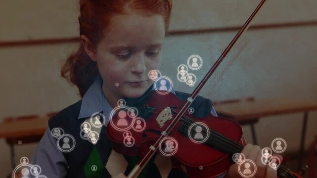 Animation of icons appearing over caucasian girl playing violin at school
