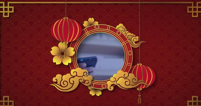 Animation of chinese frame over hand paying with smartphone