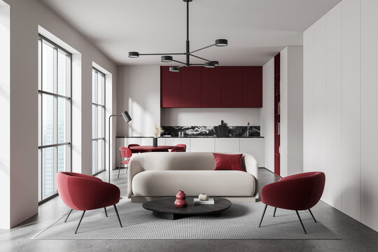 Contemporary interior living room and kitchen space featuring red and white design details with soft daylight illuminating the modern architecture."" 3D Rendering