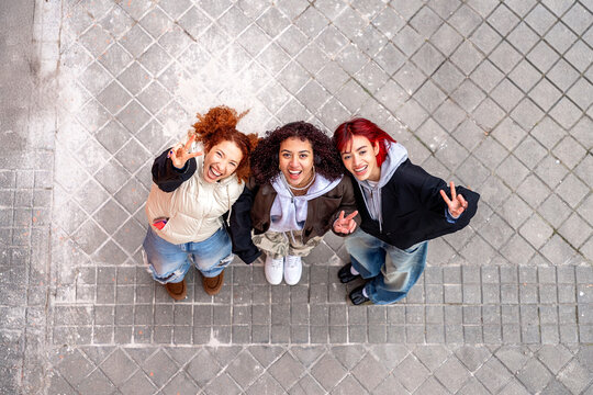Young women expressing friendship in urban setting