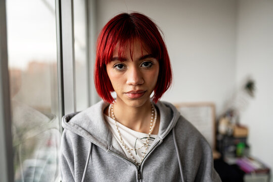 Young woman with red hair in an urban setting