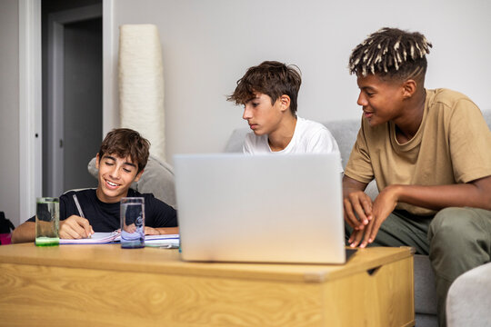 Gen-z friends studying with focus and smiles