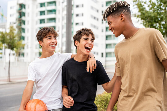 Gen-z friends laughing and bonding outdoors