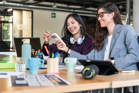 Businesswomen collaborating in modern office