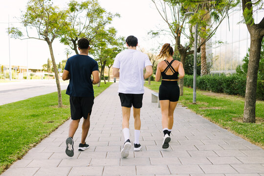Multiethnic friends enjoying urban jogging