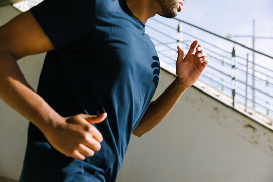 Athlete running outdoors in urban environment