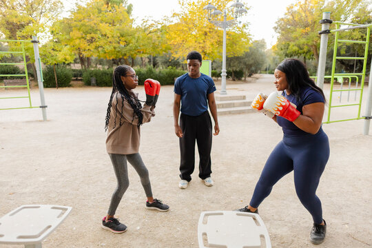 Boxing training session in outdoor park setting