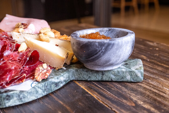 Charcuterie board with cured ham and cheese
