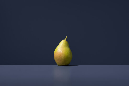 Lemon pear with contrasting dark background