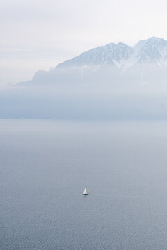 Scenic view of a sailboat on serene Lake Geneva
