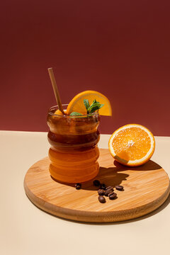 Refreshing iced citrus americano with orange garnish