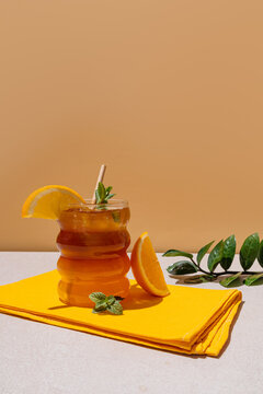 Refreshing iced citrus Americano with orange garnish