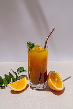 A vibrant iced citrus Americano with fresh orange slices