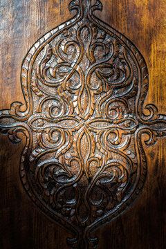 Intricate wood carving on traditional Moroccan door