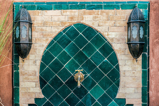 Elegant Moroccan gold tap with ornate tile backdrop