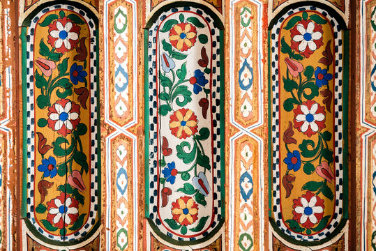 Intricate Moroccan ceiling art with floral patterns