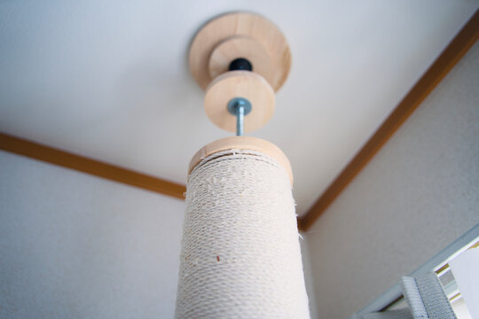 Cat scratching post with ceiling tension mount