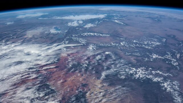 Day Earth Slow Rotation White Clouds Colorful Mountains From ISS.
Source material provided by NASA.