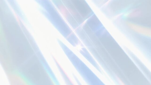 虹色のプリズム光とレンズフレアの抽象背景　水色