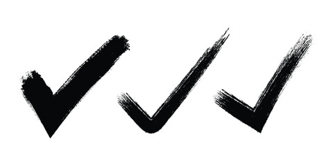 Three black checkmarks with brush stroke texture on white background © MdSadikul