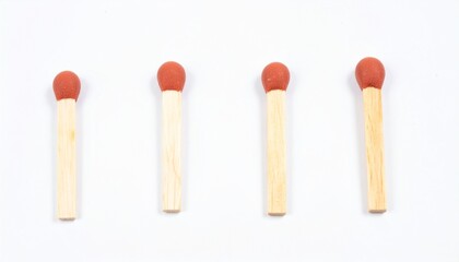 Four wooden matchsticks with red tips on white background