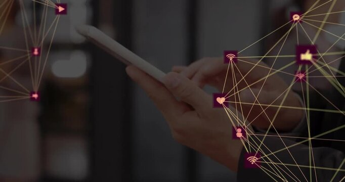 Animation of network of connections with icons over caucasian businesswoman using tablet