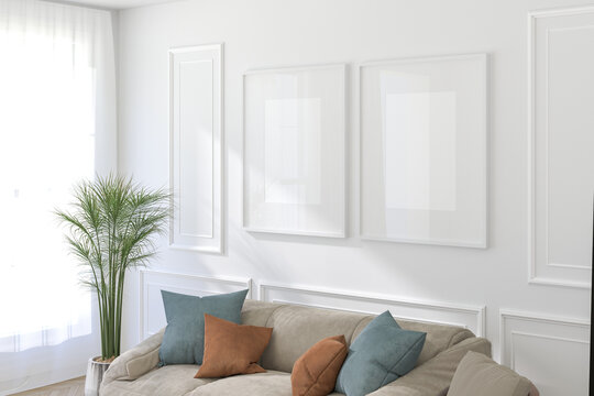3D Render of Two White Frames Above Sofa on Light Wall in Modern Interior
