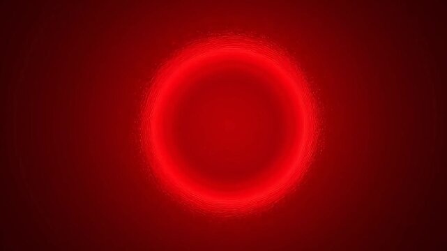 Red circular light pattern on dark background
