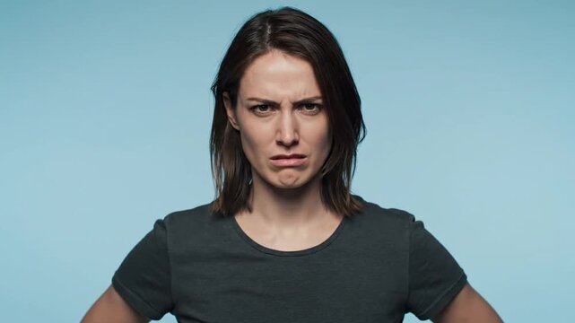 A woman displays a series of facial expressions, progressing from a neutral face to different shades of anger and frustration, with each row showing more intense emotion, against a plain background.
