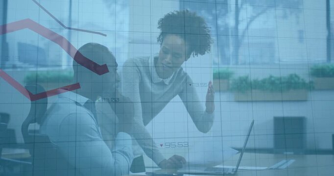 Female coworker pointing at laptop showing downward market chart and male colleague analyzing data