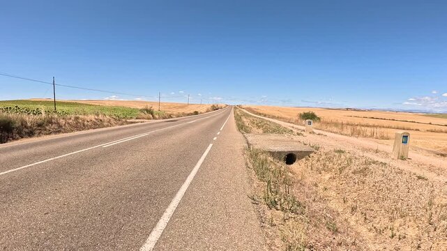 French Way of Saint James - P-980 paved road between Villalcazar de Sirga and Carrion de los Condes, province of Palencia, Castile and Leon, Spain