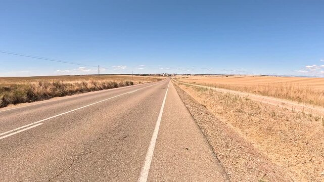 French Way of Saint James - P-980 paved road near Carrion de los Condes, province of Palencia, Castile and Leon, Spain