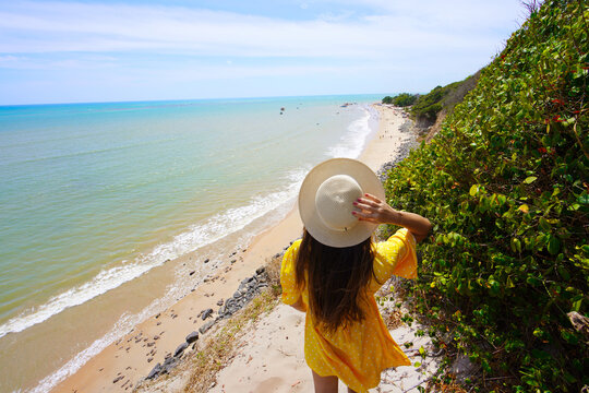 Holidays in Brazil. Travel woman looking at Ponta do Seixas in Joao Pessoa, is the easternmost point of the American continent.