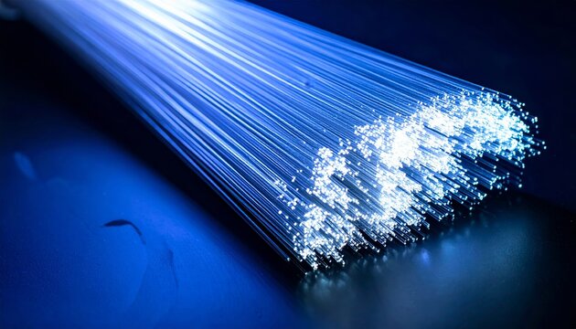 Glowing Fiber Optic Cables with Blue Light on Dark Background