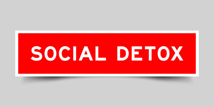 Red color square shape sticker label with word social detox on gray background