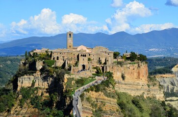 The famous Civita di Bagnoregio on a sunny day. Province of Viterbo, Lazio, Italy. Medieval town on the mountain, Civita di Bagnoregio, popular touristic stop at Tuscany, Italy