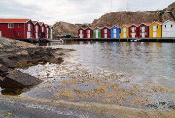 Obraz premium Rocky harbor with traditional fishing houses in Smögen Sweden