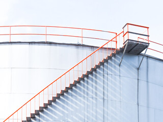 Close-up of Industrial Staircase and Platform on White Storage Tank