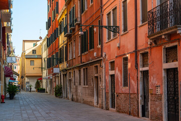Venice street alley, typical architecture, colorful picturesque buildings