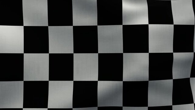 Black and white checkered flag moving in the wind, filling the entire screen