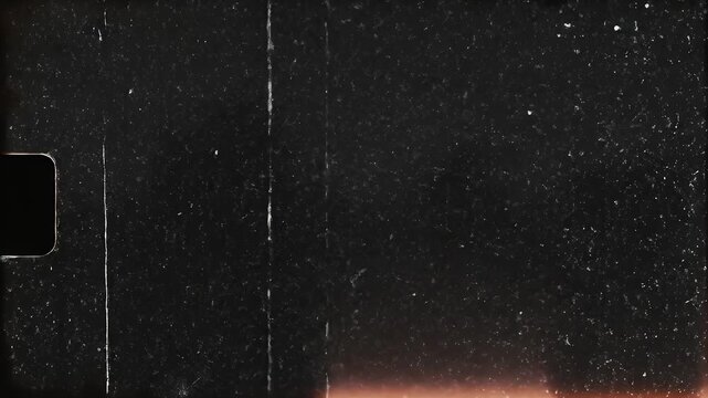 A textured, black filmstrip with scratches, light leaks, and a frame corner