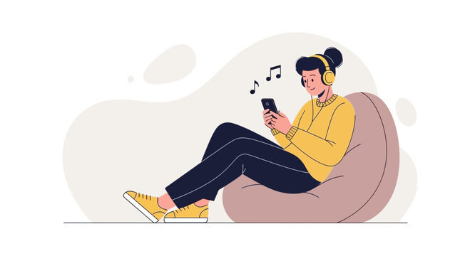 Young person relaxing on beanbag chair listening to music on smartphone with headphones