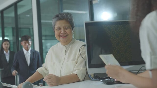 Airport Check-in Counter. Verifying Passenger During Passport Check in International Airport Terminal. air hostess checks passport and boarding pass at airport. traveler customer service before flight
