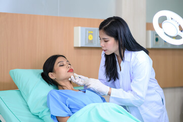 Woman doctor cosmetologist injects a filler into the cheek of the patient's woman. Cosmetology concept.