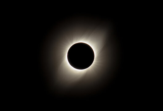 Close up of a total solar eclipse with corona around the Sun