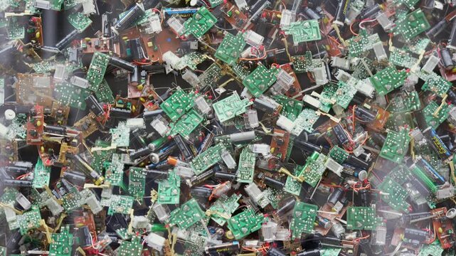 Close up background of electronic waste with circuit boards and wires recycling concept